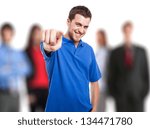 Smiling man pointing his finger to you