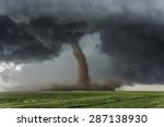 Beautiful tornado over a green field