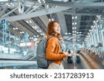 Happy attractive asian woman traveler with backpack at the modern airport terminal, copy space, Tourist journey trip concept