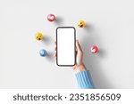 Hand of woman holding blank mobile phone with love, like, comment, hashtag button on white background. Social media marketing concept