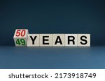 Small photo of 49 - 50 Years. The cubes form the expression 49 - 50 Years Anniversary. The concept of the anniversary of the age of both a person and a company.