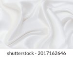 Background abstract texture of natural light color fabric. Fabric texture of natural cotton or linen, silk or satin, wool or jersey textile material. Luxurious white canvas background.