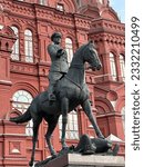 Small photo of MOSCOW, RUSSIA - July 15,2023: Monument to Marshal Georgy Zhukov at the Manege Square in Moscow against the background of the Historical Museum