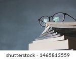 Glasses on stack of books
