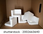Small photo of EPS foam in a cardboard box. Expanded Polystyrene foam is a product of styrene monomer.