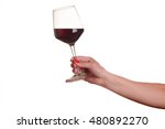 female hand with red wine glass on a white background
