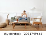 Woman relaxing in a minimal home