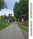 Small photo of Unrestricted level crossing Andreaskreuz with country road