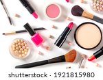 Make-up products, shot from the top on a white background. Various cosmetics