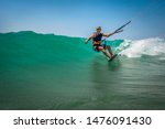 A Kite Surfer Riding Sea Waves...