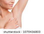 Armpit epilation, lacer hair removal. Beauty Young Woman holding her arms up and showing clean underarms, depilation smooth  clear skin. Beauty  portrait. Beautiful Girl after removal hair under her  