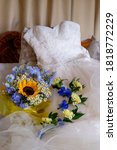 Small photo of Wedding floral on top of the wedding dress with selective focus to emphasise the flowers