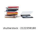 CD in an open box and a stack of discs on a white background