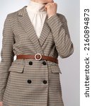 Woman in a plaid blazer and a...