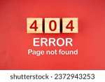 Wooden cubes with 404 error page not found on red background.