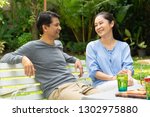 Small photo of Asian Elderly couple enjoying outdoor party in home garden after work life. Retired people caring a healthy meal after retirement salutary good food good Life insurance concept.
