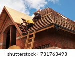 Roofing Contractors Installing House Roof Board for Asphalt Shingles. Roofing Contractor. Roofing Construction. Roof Repair.