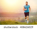 Athletic young man running in the nature. Healthy lifestyle