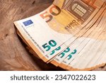 Euro banknotes in vintage wooden container. Concept saving money