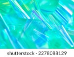 Small photo of Close-up of ethereal pastel neon mint, turquoise, blue, green holographic metallic foil background. Abstract modern curved soft focused, blurred, surreal futuristic disco, rave, dreamlike backdrop