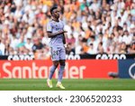 Small photo of Vinicius Junior gestures a deuce with his fingers to provoke the Valencia fans during the LaLiga Santander match between Valencia CF and Real Madrid CF at Estadio Mestalla on May 21, 2023 in Valencia