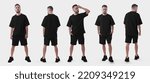 Small photo of Mockup of a black oversized suit on a brutal guy in sneakers, front, back view, isolated on background. Set of t-shirts, shorts on a man, for design, pattern, branding. Men's clothing template
