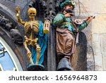 Statues of Skeleton or Death  and Turkish Man on Tower with Prague Astronomical Clock Orloj