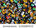Small photo of BERLIN - MAR 30: Heap of used old Kodak and many another film cartridges 35 mm at a photo store in Berlin, March 30. 2022 in Germany