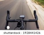 Top view of a gravel bicycle riding on the road with blurred background. Active lifestyle concept.