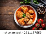 Small photo of Homemade Cabbage rolls with meat, rice and vegetables. Stuffed cabbage leaves also known as sarma, golubtsy, dolma on Dark Rustic Background