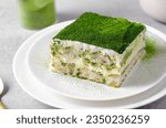Matcha Tiramisu, Italian Tiramisu Cake with Green Tea on Concrete Background