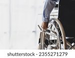Man sitting in wheelchair at...