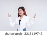 Small photo of A nonchalant young woman raising her hands and shrugging in disinterest. Isolated on a white background.
