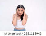 Small photo of An unnerved young asian woman having a panic attack. Looking at camera with a worried expression. Isolated on a white background.