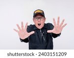 Small photo of A strict male security guard shouting ordering you to stop. Gesturing with palm to halt, commanding with urgency and heightened emotions. Isolated on a white background.
