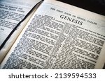 Small photo of Page from 1971 King James Bible open at Genesis, Shallow depth of field, focus on heading
