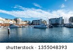 Harbour in Eastbourne with yahts, blue sky and water.