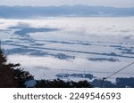 Temperature inversion forms cloudsea in snowy town and lake (Inawashiro, Fukushima, Japan)