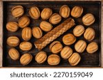 Tasty walnut shaped cookies with boiled condensed milk and sweet tube with condensed milk