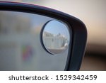 Close up of right blind spot car side mirror