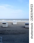 Small photo of Blankenberge, West-Flanders, Belgium - March 30, 2023: end winter. Springtime is the start of the log season. The beach cabins reappear on the beach