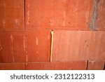 Small photo of Close-up flat wall insulating hollow brick masonry bonded with non-recyclable rising foam. Mortar, on the other hand, is recyclable when the building is demolished