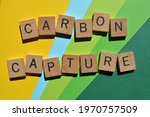 Carbon Capture, words in wooden alphabet letters isolated on green, blue and yellow