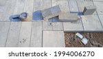 Small photo of Gray Paving Stones. Styling. In a chaotic and disharmonious situation