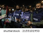 Small photo of Palestinians take part in a candlelight vigil to condemn the killing of veteran Al Jazeera journalist Shireen Abu Aqleh, in Rafah, in the southern Gaza Strip, on May 11, 2022.