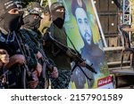 Small photo of Palestinian fighters of the military wing of Palestinian Islamic Jihad, attend a a rally marking Palestinians commemorate Israel's war on Gaza in May last year, in Gaza Strip, on May 18, 2022.