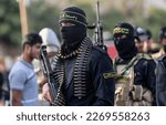 Small photo of Palestinian militants from Al-Quds Brigades, the military wing of the Islamic Jihad movement, hold a military parade in support with the residents of Hawara, in southern Gaza Strip, on March 2, 2023.