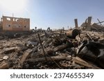 Small photo of Palestinians search building after an Israeli air strike, in the city of Rafah, southern of the Gaza Strip, on October 13 2023.
