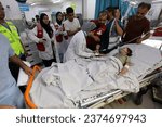 Small photo of Wounded Palestinians were transferred to Al-Najjar Hospital after being targeted by Israeli warplanes, in the city of Rafah, south of the Gaza Strip, on October 13 2023.