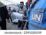 Small photo of UNRWA distributes bags of flour to displaced Palestinians from Beit Lahia, Beit Hanoun and Gaza. This is for the first time since the beginning of the Israeli war on Gaza Strip, on November 21, 2023.